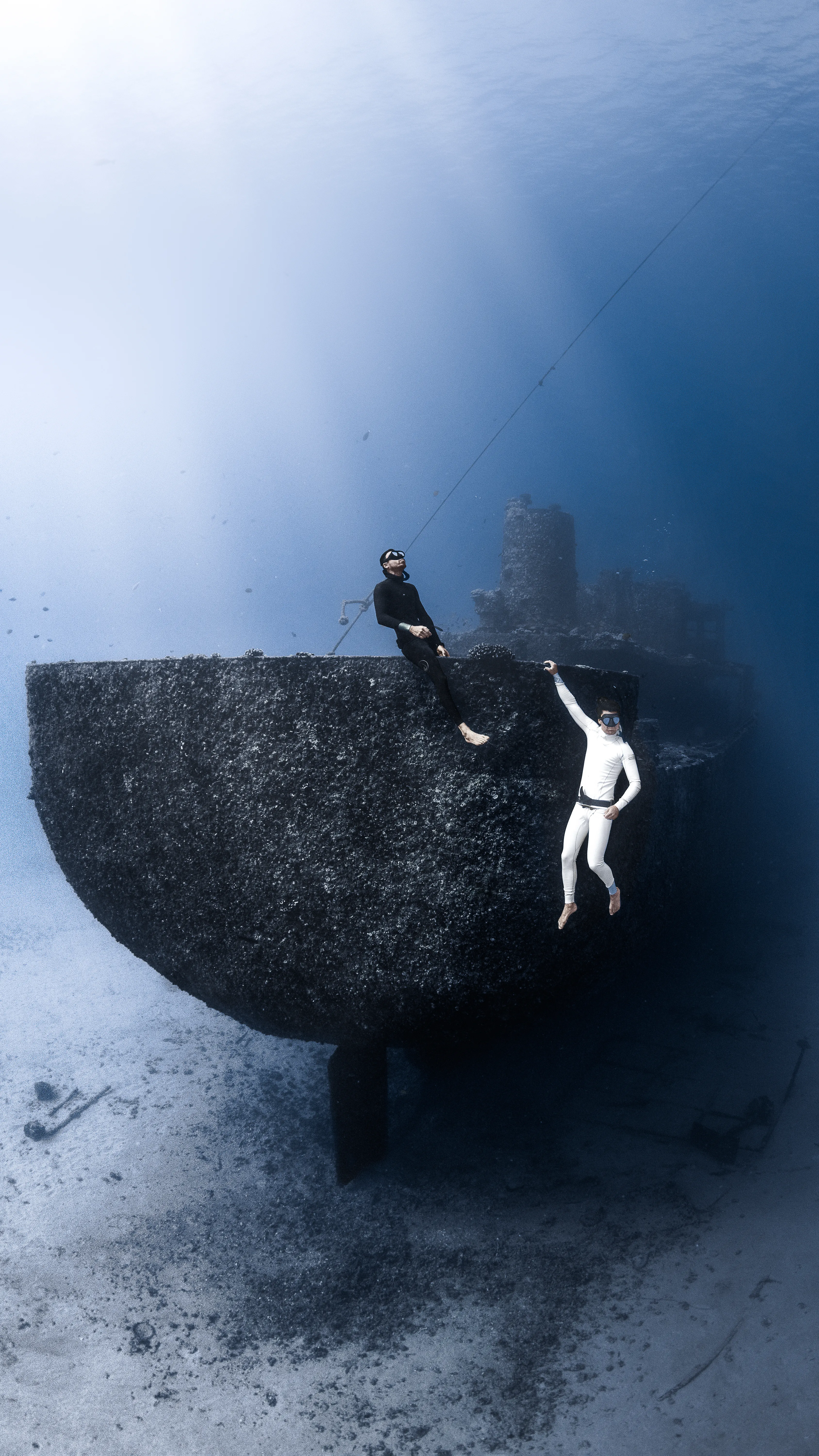 Diver and light rays, Hawaii